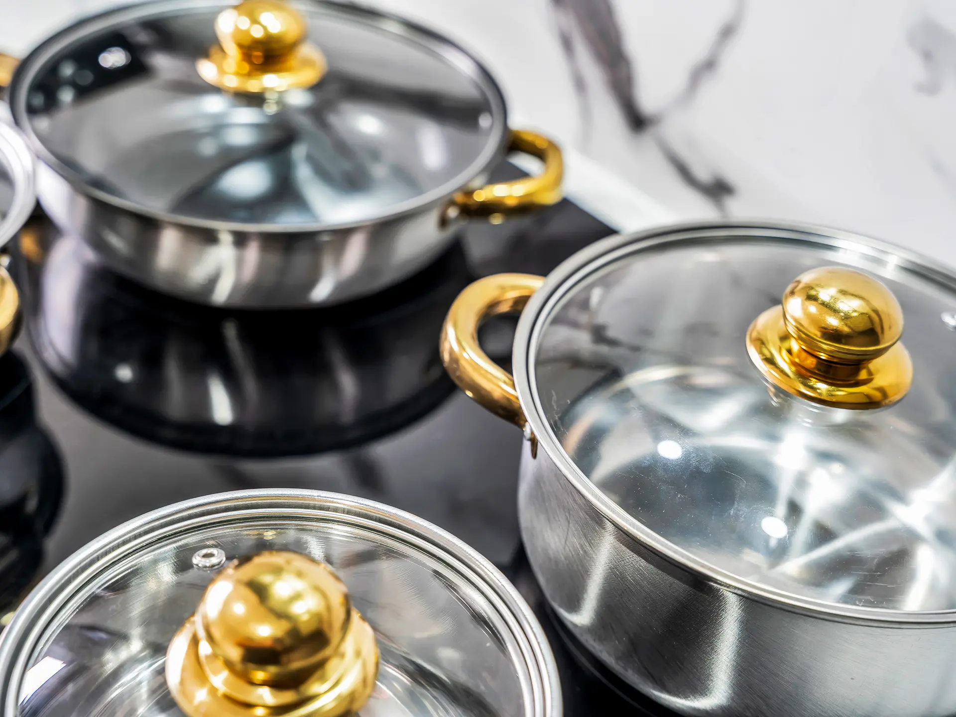 Modern apartment cookware set in a fully equipped kitchen